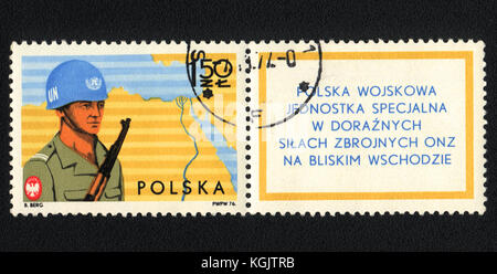 A postage stamp printed in Poland  shows Polish military special unit in ad hoc UN Armed Forces in the Middle East ,  circa 1977 Stock Photo