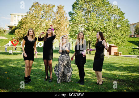 Five girls wear on black jumping at hen party. Stock Photo