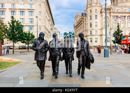 Bronze statue of the four Liverpool Beatles stands on Liverpool Waterfront by sculptor Andrew Edwards. Stock Photo