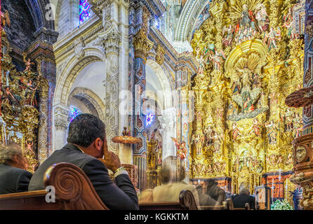 People attending Catholic mass, El Salvador church, Seville, Spain