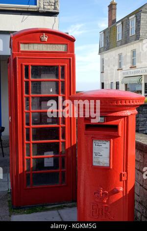 Red telephone kiosk and red post box in Swanage Dorset England UK Stock Photo