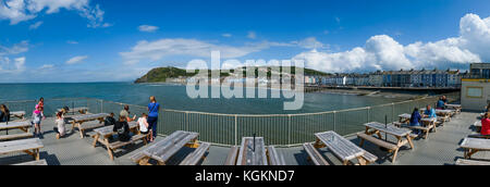 People on the deck outside the Royal Pier Aberystwyth, Wales UK Stock Photo