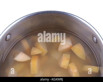 apple compote in a saucepan on a white background Stock Photo