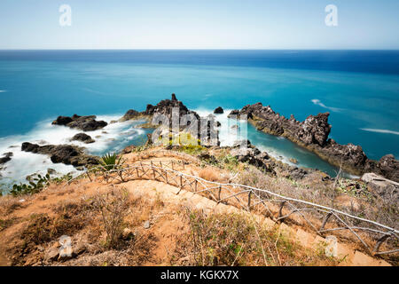 Long exposure of a path leading down to rocky a tide pool area near Funchal in Madeira, Portugal. Stock Photo