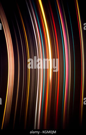 Abstract image of colorful light trails against black background Stock Photo