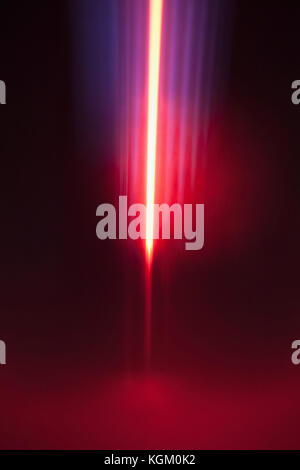 Close-up of abstract red and blue light trails against black background Stock Photo