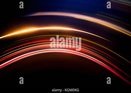 Full frame abstract image of vibrant light trails against black background Stock Photo