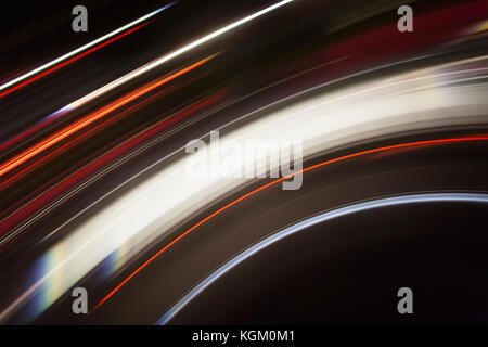 Directly above shot of abstract light trails against black background Stock Photo