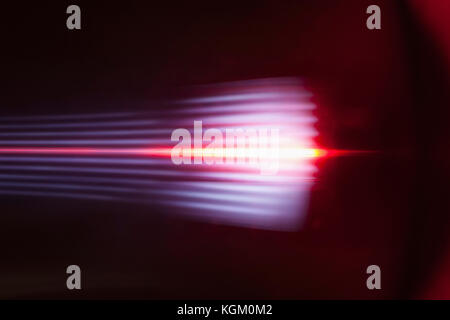 Abstract light trails against black background Stock Photo