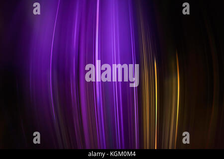 Full frame abstract image of purple and golden light trails Stock Photo