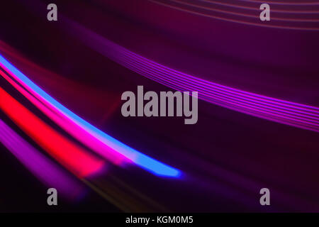 Full frame abstract image of vibrant purple and red light trails Stock Photo