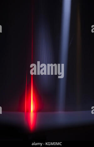 Abstract image of red and gray light trails over black background Stock Photo