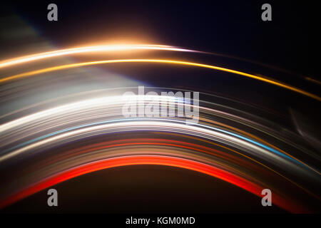 Various abstract light trails against black background Stock Photo
