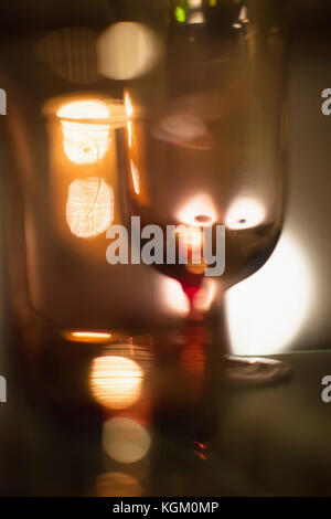 Abstract image of wineglass against illuminated background Stock Photo