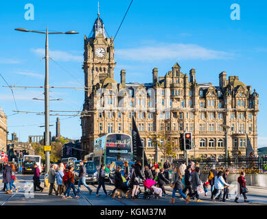 View along Princes street to the  Balmoral Hotel with busy pedestrian crossing Edinburgh , Scotland, United Kingdom. Stock Photo