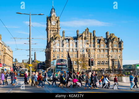 View along Princes street to the  Balmoral Hotel with busy pedestrian crossing Edinburgh , Scotland, United Kingdom. Stock Photo