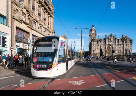 View along Princes street with tram and Balmoral Hotel visible in Edinburgh , Scotland, United Kingdom. Stock Photo