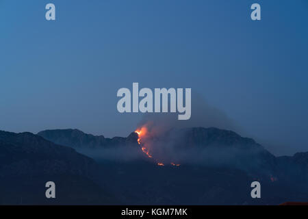 Burning mountain at dusk Stock Photo