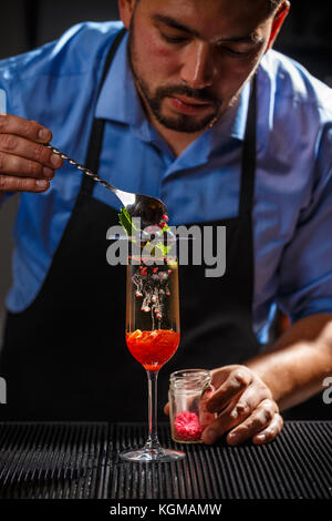 Bartender preparing fancy champagne cocktai Stock Photo