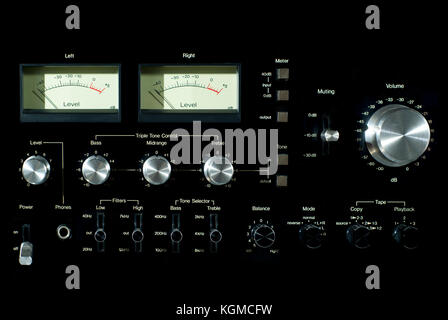 Front panel section of audio power amplifier with switches and knobs Stock Photo