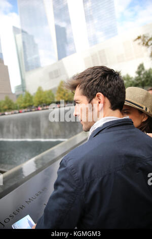 Tourists visiting 911 memorial in Manhattan Stock Photo