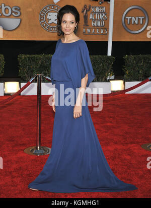 Angelina Jolie -  Sag - Screen Actor Guild Awards 2009  at the Shrine Auditorium in Los AngelesAngelina Jolie 100  = Fashion, full length, People,  Angelina Jolie, Actress, Vertical, , USA, Celebrities, Looking At Camera, Arts Culture and Entertainment, Event, Attending,  , One Woman Only, One Person,  Portrait, , Wavy Hair.  artist Stock Photo