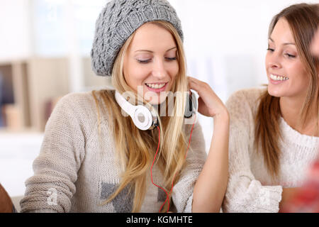 Girlfiends having fun listening to music Stock Photo