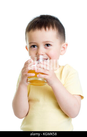 Happy little boy drinking fresh juice, isolated on white background Stock Photo