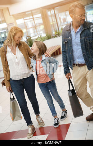 Family on shopping day walking in mall Stock Photo