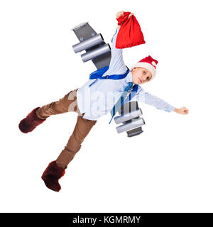 Young Santa Claus flying with presents for Christmas on a jetpack. Isolated on white Stock Photo