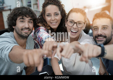 Group of start-up people in office pointing at camera Stock Photo