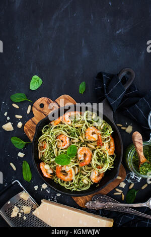 Spaghetti with prawns and homemade pesto sauce, top view Stock Photo