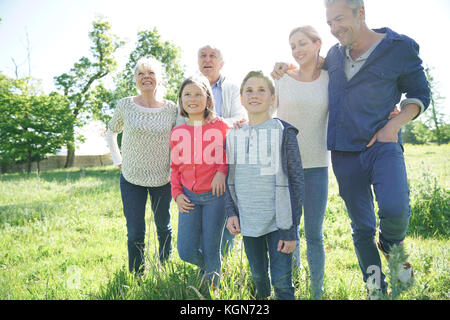 Happy intergenerational family walking in park Stock Photo