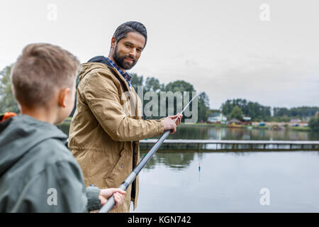 father and son fishing on lake Stock Photo