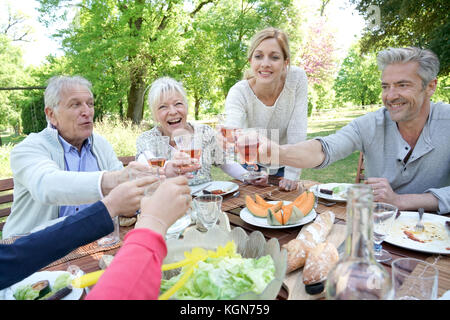 Family having summer lunch in garden Stock Photo