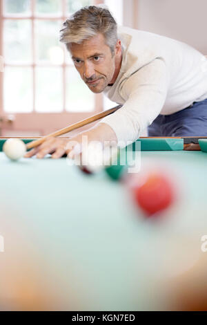 Man playing american pool Stock Photo