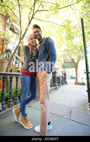 Trendy in love couple enjoying walk in Greenwich village Stock Photo