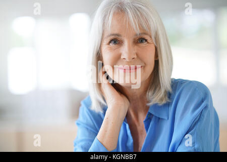 Portrait of senior woman with blue shirt Stock Photo