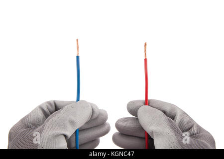 Red and Blue parallel wires in hands with protective gloves isolated on white background Stock Photo