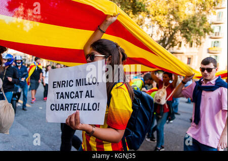 Barcelona, 10 october 2017 - people march in the street of barcelona asking for catalunya's independence holding catalan flags Stock Photo