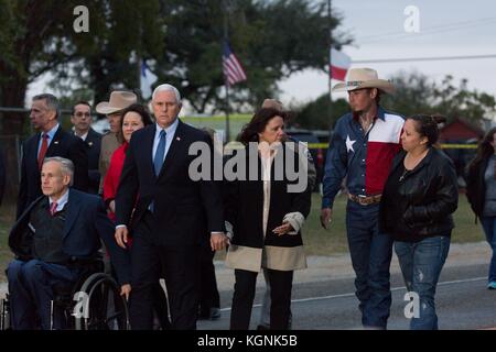 Texas, USA. 8th November, 2017. U.S. Vice President Mike Pence and Karen Pence walk alongside Texas Gov. Greg Abbott, left, and Johnnie Langendorff, right, and his girlfriend Summer Caddell, right, during a visit to the Sutherland Springs Baptist Church shooting November 8, 2017 in Floresville, Texas. Johnnie Langendorff helped stop the gunman and gave chase along with Stephen Willeford. Credit: Planetpix/Alamy Live News Stock Photo
