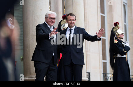 Paris, France. 10th Nov, 2017. French President Emmanuel Macron welcomes German President Frank-Walter Steinmeier (L) with military honours at the Elysee Palace in Paris, France, 10 November 2017. After their meeting Steinmeier and Macron will pay a visit to the Hartmannsweilerkopf memorial site in the Alsace region to commemorate the soldiers of World War I. Credit: Bernd von Jutrczenka/dpa/Alamy Live News