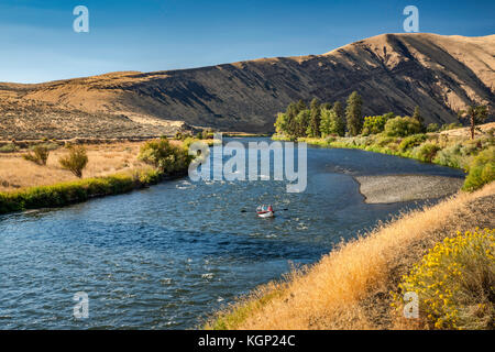 Yakima River Canyon, two men in a boat, Columbia Plateau, near Yakima, Washington state, USA Stock Photo