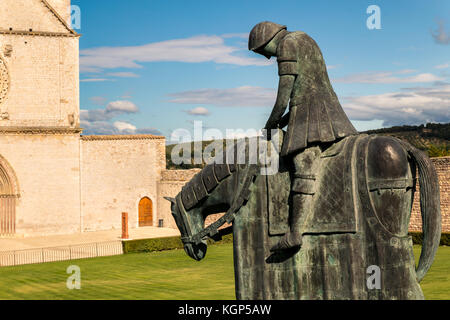 St. Francis of Assisi Church with the statue of St. Francis on a horse in the foreground. St. Francis is the patron saint of Italy. The bell tower can Stock Photo