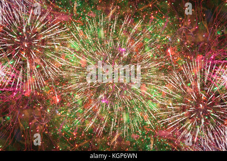 Colorful bright fireworks against dark sky Stock Photo