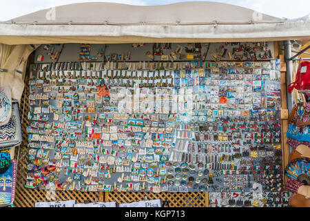 Souvenirs for sale at stalls close to the Leaning Tower of Pisa, Tuscany, Italy Stock Photo