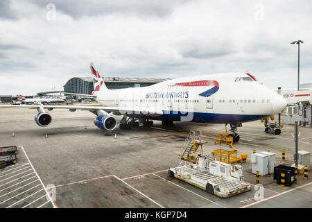 British Airways Boeing 747 airliner parks at a gate at Heathrow Airport Terminal 5 Stock Photo