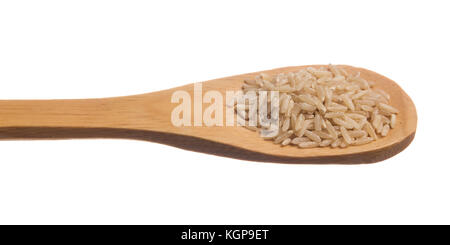 Oryza sativa is scientific name of Chinese Rice seed. Grains over wooden spoon, isolated white background. Stock Photo