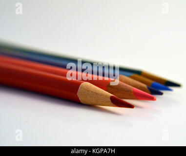 Colored pencils lined up in a row. Stock Photo
