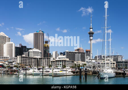 AUCKLAND, NEW ZEALAND - MARCH 1, 2017: Yachst anchored in the Viaduct harbour in Auckland with the business district skyline and the sky tower in New  Stock Photo